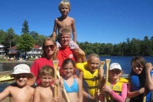 Group of kids with two Kids Club supervisors.