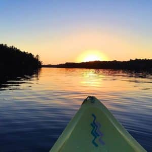 Canoe on the lake at sunset.