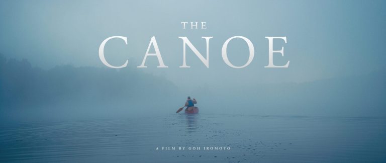 Person in canoe in fog. Text: The Canoe