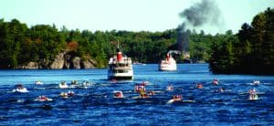 RMS Segwun and smaller boats on the lake.