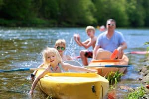 Kids and parents in kayaks.