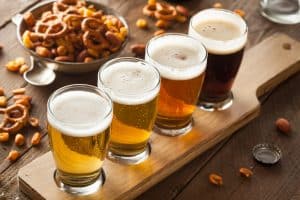 Flight of beers with peanuts and pretzels