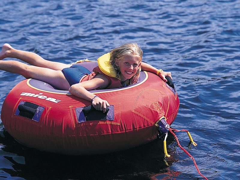 Photo of a Young Girl Water Tubing, One of the Best Things to Do in Muskoka with Kids.