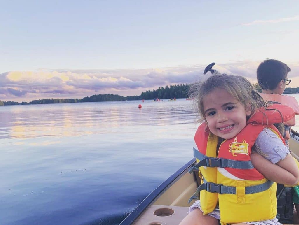 Photo of a Young, Happy Girl on a Canoe at Severn, One of the Best Ontario Getaways in Spring.