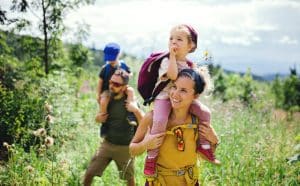 A young family of four enjoys the summer landscape in Muskoka.