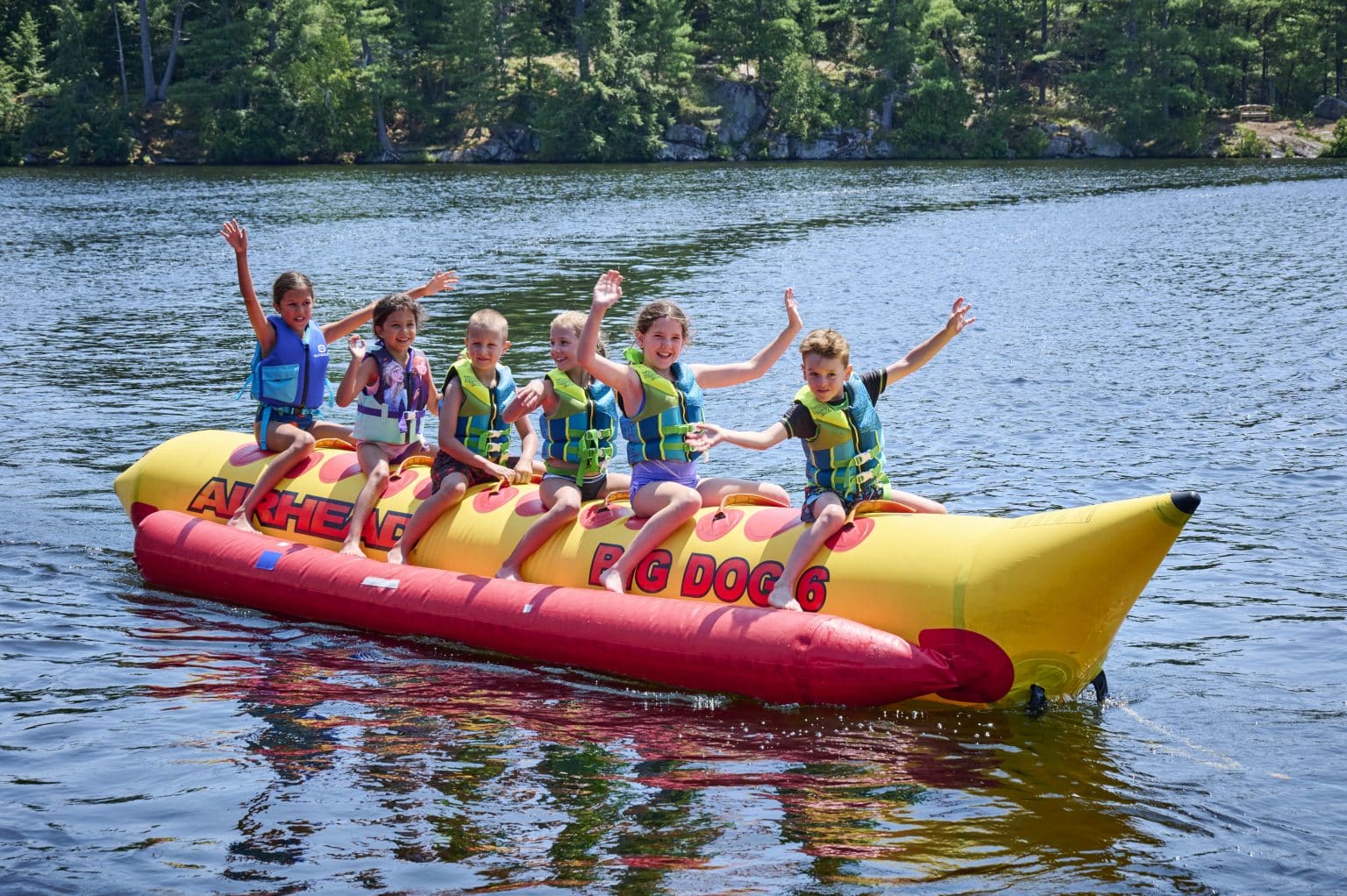 Kids riding a banana boat