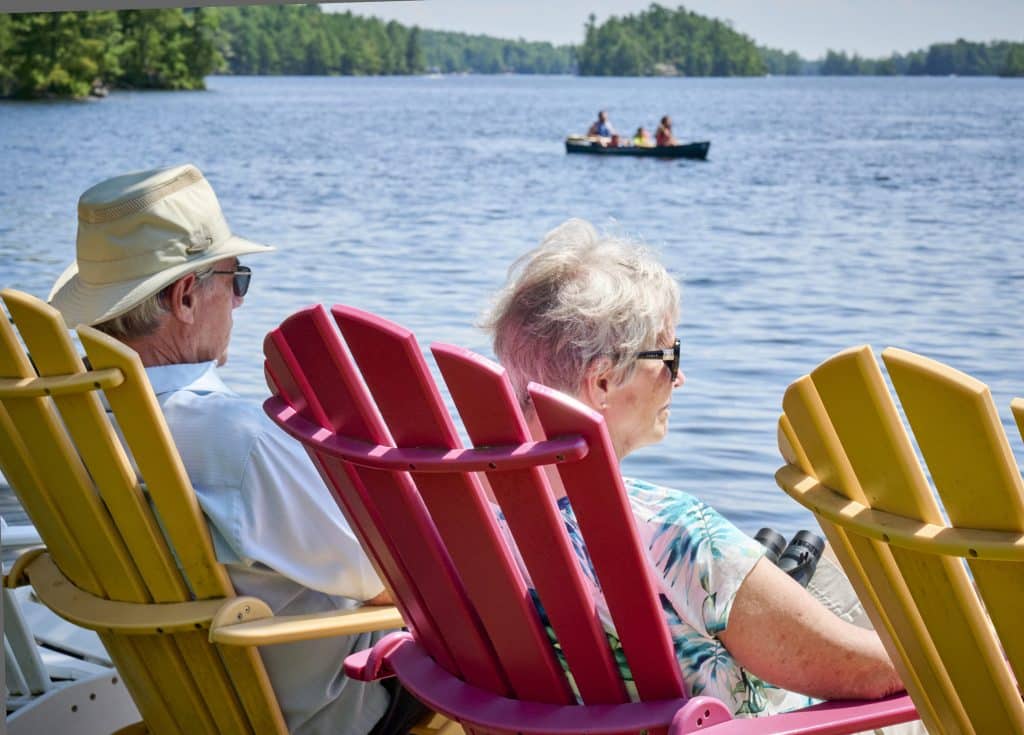 Muskoka Getaways for Couples: A couple sits at the dock at Severn Lodge.