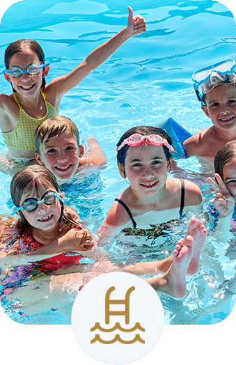 Large group of kids having fun in a swimming pool