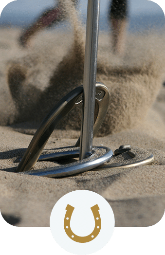 Horseshoe game in beach sand