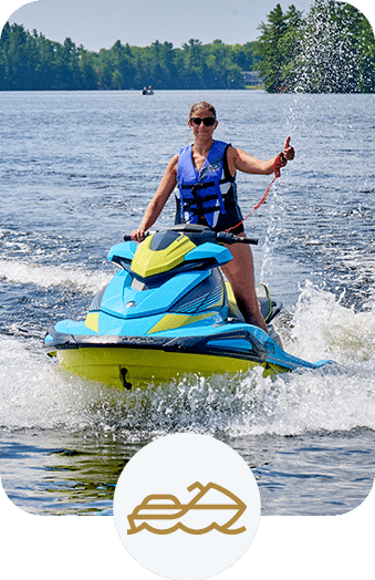 Women giving the thumbs up while jetskiing