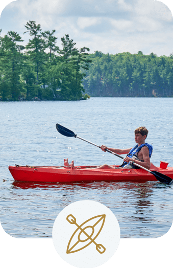 Boy kayaking on a beautiful lake