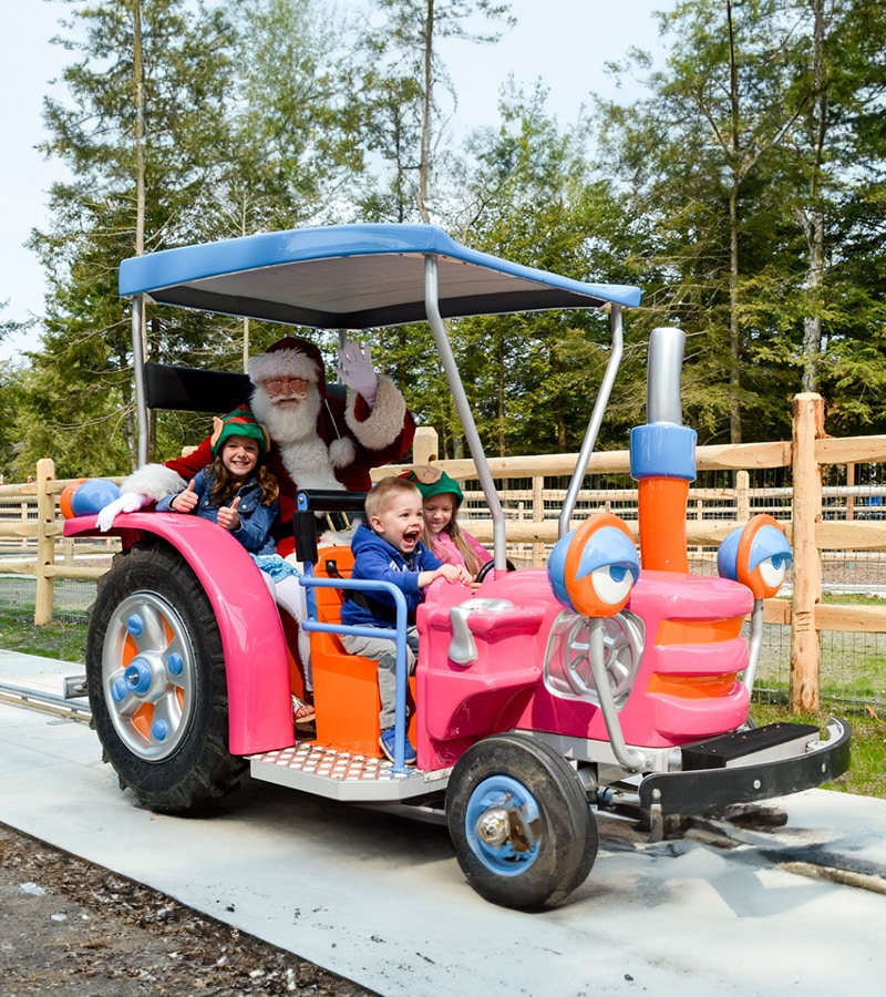 Riding in a toy car with Santa