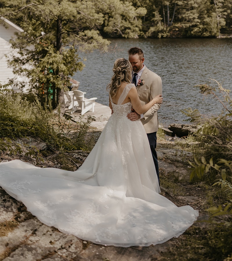 Newlyweds standing in a beautiful nature scene