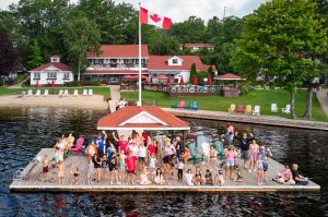 Muskoka Resorts All Inclusive: A large group of guests pose at the end of the dock at Severn Lodge.