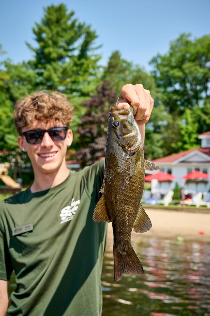 Ontario Family Resorts: A young angler holds a nice smallmouth bass at Severn Lodge on Gloucester Pool.