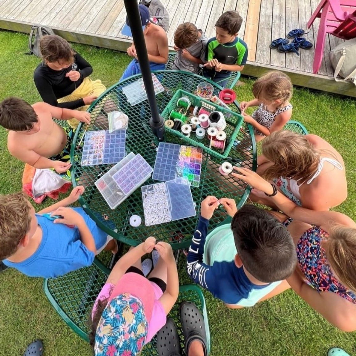 A group of kids doing arts and crafts outside